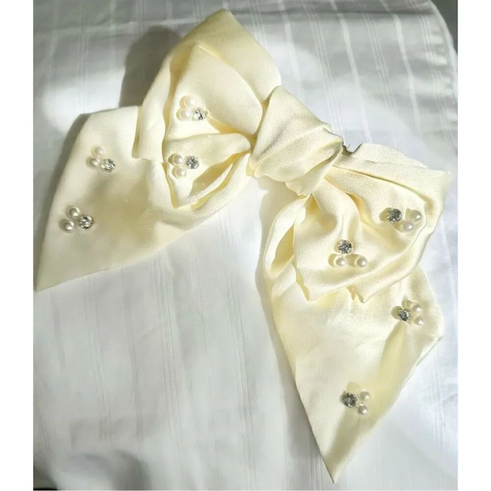Off-white barrette hair bow with pearl and rhinestone embellishment 